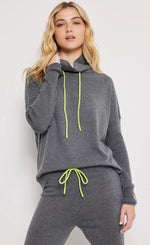 Load image into Gallery viewer, Front top half view of a woman wearing the lisa todd chill factor jogger and pullover
