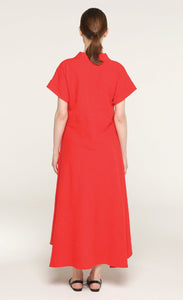 Back full body view of a woman wearing the igor cate dress in red.