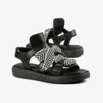 Load image into Gallery viewer, front view of a pair of the all black footwear bowlace sandal

