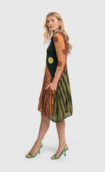 Load image into Gallery viewer, Left side full body view of a woman wearing the alembika mix pocket dress.
