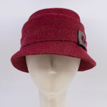 Load image into Gallery viewer, Front view of the lillie &amp; cohoe mohair Freda hat. This hat is red with a tiered crown and a front decorative wooden buckle/button
