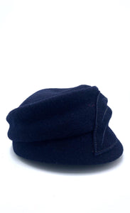 Right side view of the mao now hat in navy. This hat has a large stitched leaf on the left side.