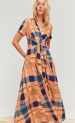 Load image into Gallery viewer, Front full body view of a woman wearing the orange green, and blue plaid aldo martins arlet dress.
