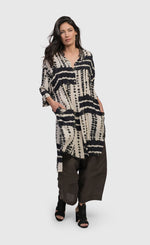 Load image into Gallery viewer, Front full body view of a woman wearing the alembika savanna adventurer tunic top
