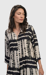 Load image into Gallery viewer, Front top half view of a woman wearing the alembika savanna adventurer tunic top
