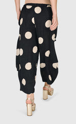 Load image into Gallery viewer, Back bottom half view of a woman wearing the Alembika Circles Party Pants
