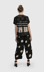 Load image into Gallery viewer, Back full body view of a woman wearing the Alembika Circles Party Pants

