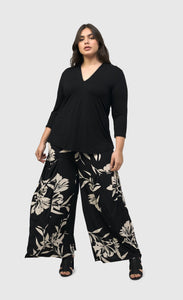 Front full body view of a woman wearing the floral bendetta palazzo pants
