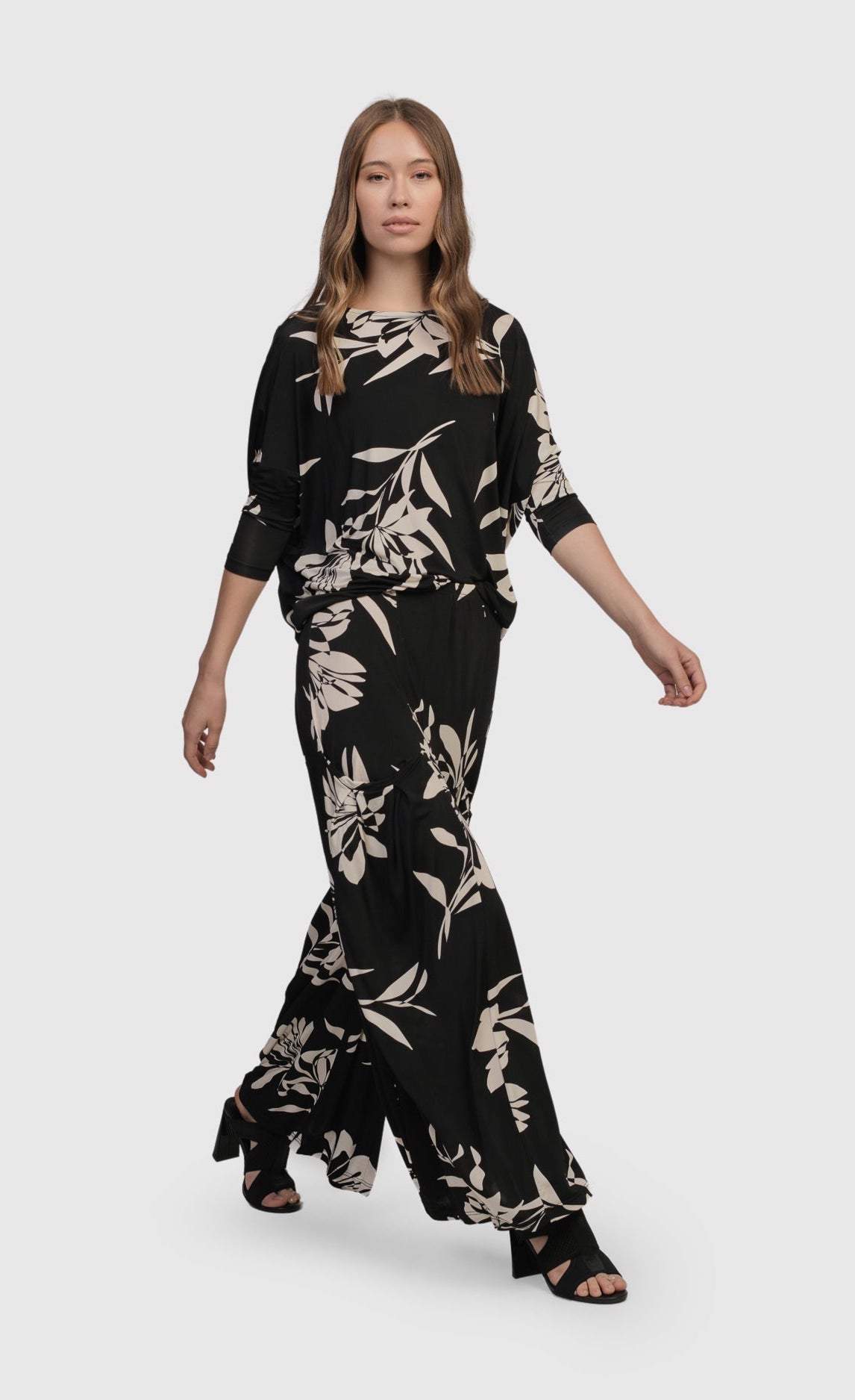 Front full body view of a woman wearing the floral bendetta palazzo pants