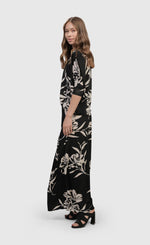 Load image into Gallery viewer, Left side full body view of a woman wearing the floral bendetta palazzo pants
