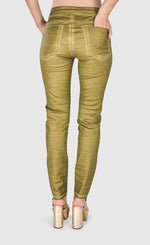 Load image into Gallery viewer, Alembika back full body view of a woman wearing the alembika iconic stretch jeans in green snake.
