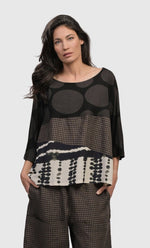Load image into Gallery viewer, Front top half view of a woman wearing the Alembika Izma Boxy Tee.
