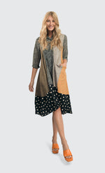 Load image into Gallery viewer, Front full body view of a woman wearing the alembika meredith trapeze shirtdress. 
