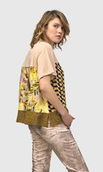 Load image into Gallery viewer, Right side top half view of a woman wearing the alembika mix escher boxy tee
