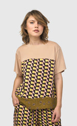 Load image into Gallery viewer, Front top half view of a woman wearing the alembika mix escher boxy tee
