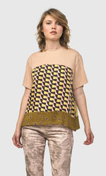 Load image into Gallery viewer, Front top half view of a woman wearing the alembika mix escher boxy tee
