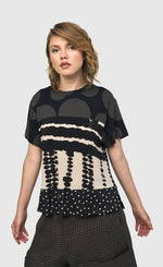 Load image into Gallery viewer, Front top half view of a woman wearing the Alembika Savanna Mountaineer Tee
