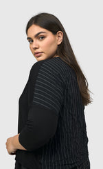 Load image into Gallery viewer, Left side top half view of a woman wearing the alembika striped andromeda cropped cardigan
