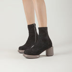 Load image into Gallery viewer, side view of a person wearing the all black footwear mod stretch bootie in black and grey
