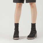 Load image into Gallery viewer, front view of a person wearing the all black footwear mod stretch bootie in black and grey
