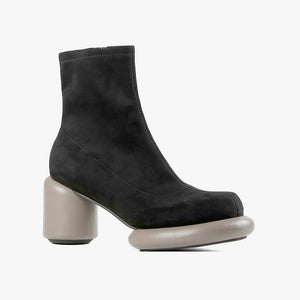 Outer side view of the all black footwear mod stretch bootie in black and grey