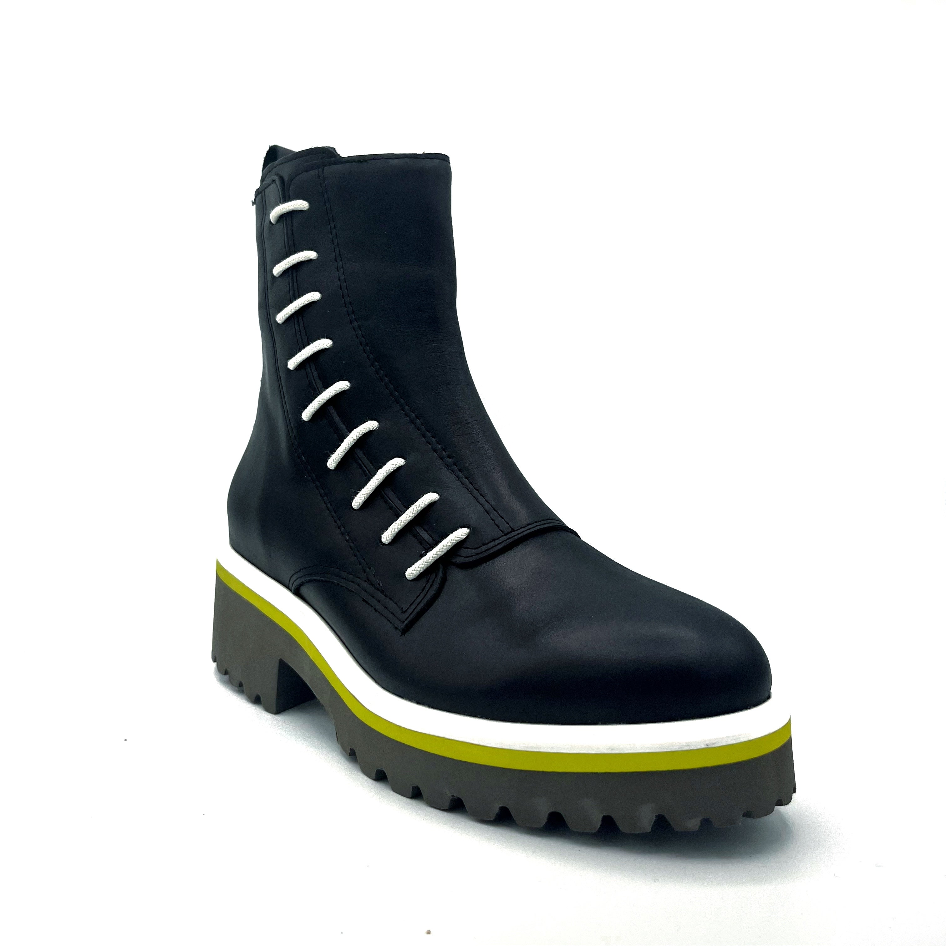 Outer front side view of the all black footwear side cord bootie in black