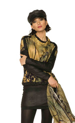 Load image into Gallery viewer, Front top half view of a woman wearing the Beate Heymann Sunset Top and holding a scarf. 
