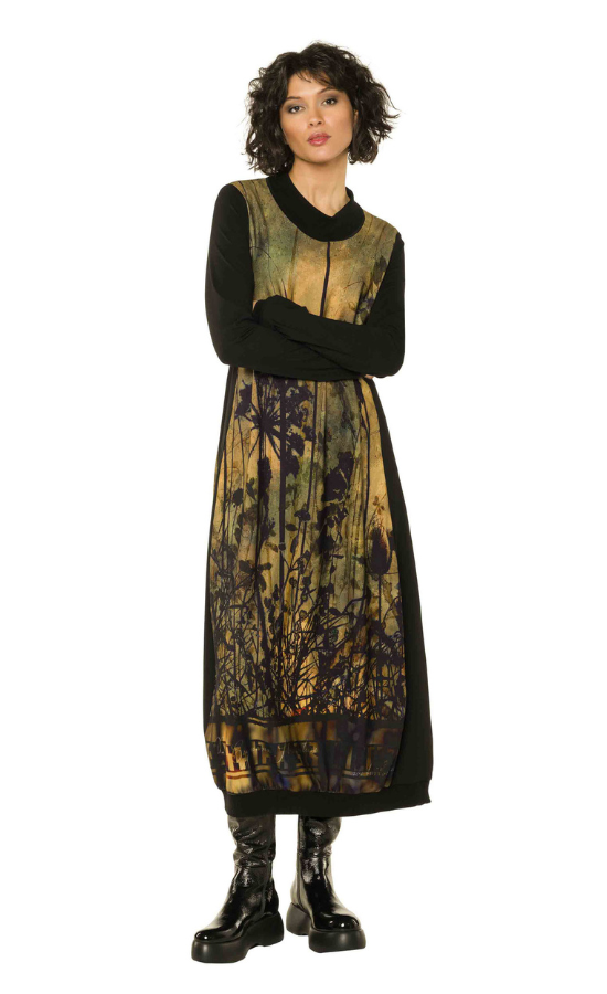 Front full body view of a woman wearing the beate heymann sunset wildflower dress in a yellow antique color.