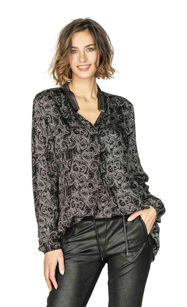 Top half front view of a woman wearing the beate heymann black strass blouse.