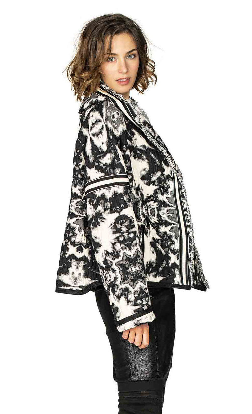 Right side top half view of a woman wearing the Beate Heymann Reversible Black & White Jacket