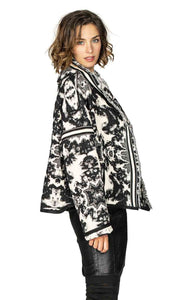 Right side top half view of a woman wearing the Beate Heymann Reversible Black & White Jacket