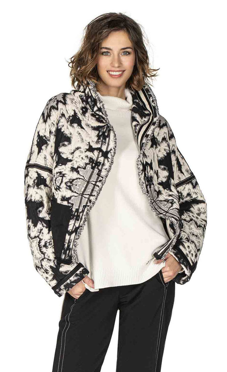 Front top half view of a woman wearing the Beate Heymann Reversible Black & White Jacket