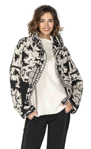 Front top half view of a woman wearing the Beate Heymann Reversible Black & White Jacket