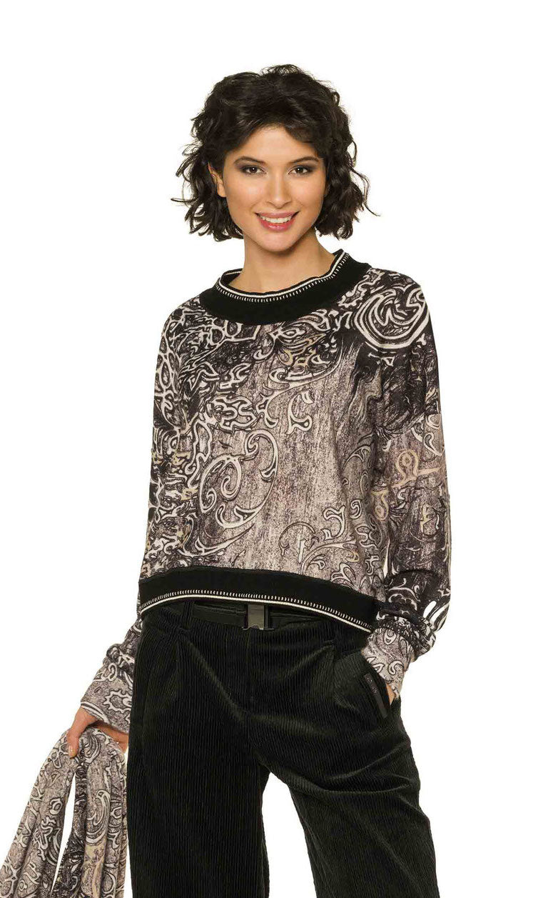 Front top half view of a woman wearing the Beate Heymann Black/Cream Ornament Top.