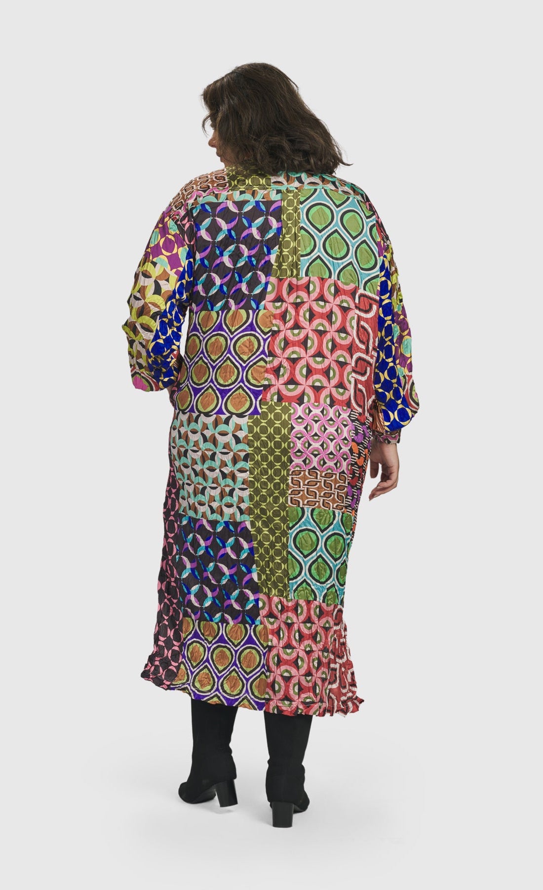 Back full body view of a woman wearing the Alembika Lucy Kaleidoscope Maxi Dress