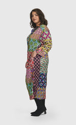 Load image into Gallery viewer, Left side full body view of a woman wearing the Alembika Lucy Kaleidoscope Maxi Dress
