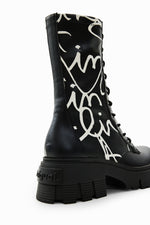 Load image into Gallery viewer, Outer front side view of the desigual message boot
