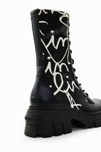 Outer front side view of the desigual message boot