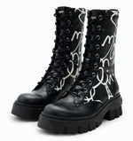 Load image into Gallery viewer, Outer and inner side view of a pair of the the desigual message boot
