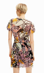 Load image into Gallery viewer, back  full body view of a woman wearing the desigual m christian la croix orchid mini dress
