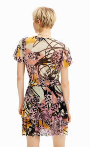 back  full body view of a woman wearing the desigual m christian la croix orchid mini dress