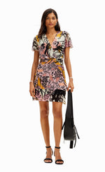 Load image into Gallery viewer, front full body view of a woman wearing the desigual m christian la croix orchid mini dress
