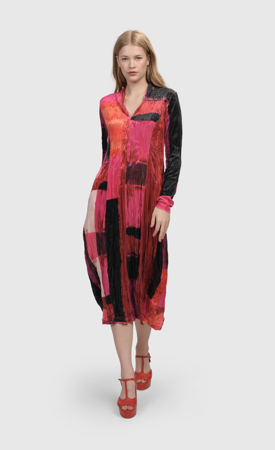 Front full body view of a woman wearing the Alembika Sunset Strip Cocoon Magenta Dress