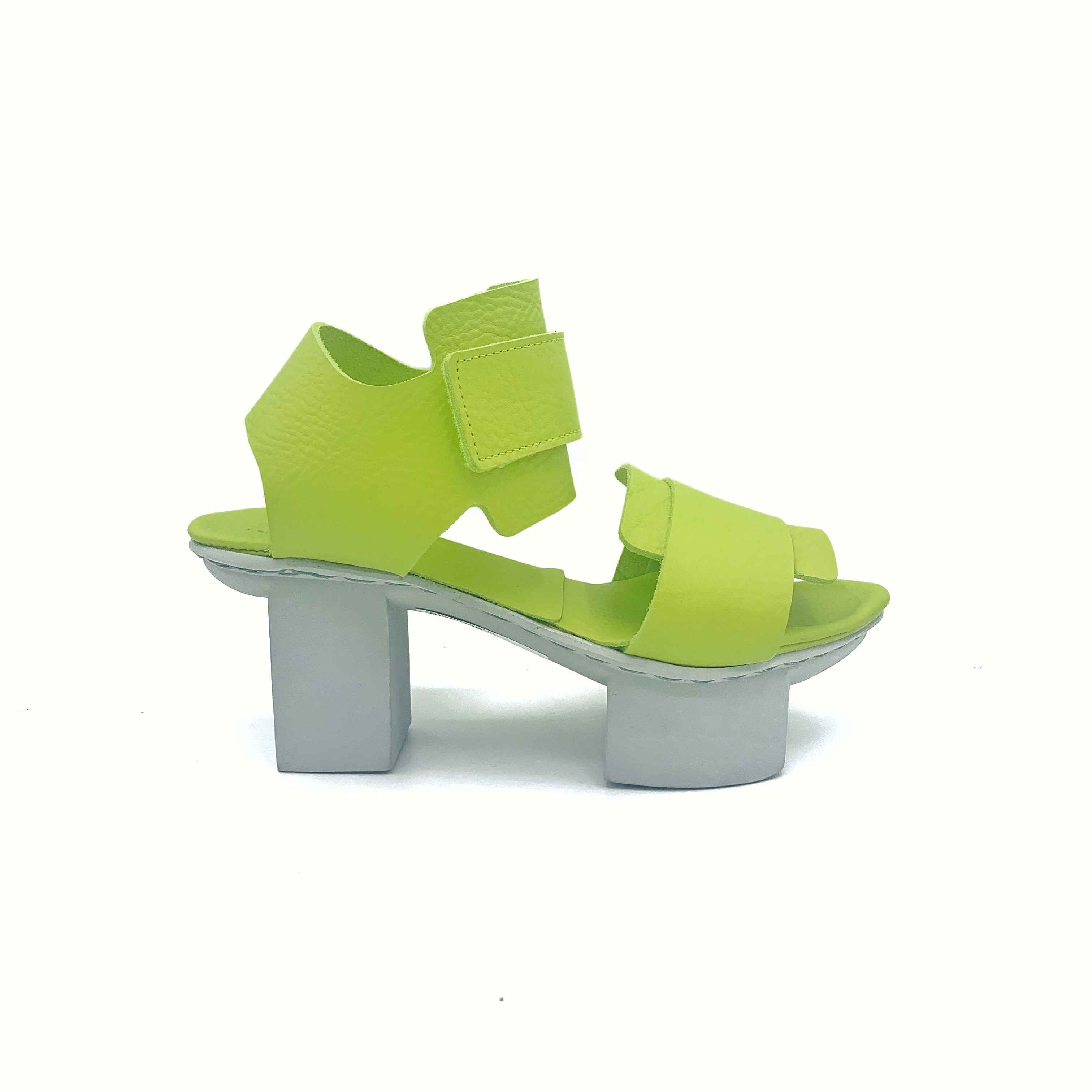 Outer side view of the trippen visor shoe in the color lime with a white sole.