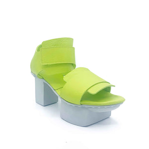 Outer front side view of the trippen visor shoe in the color lime with a white sole.