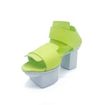 Load image into Gallery viewer, Inner front side view of the trippen visor shoe in the color lime with a white sole.
