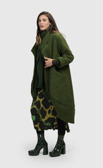 Load image into Gallery viewer, Left side full body view of a woman wearing the Alembika Green Gala Cocoon Jacket
