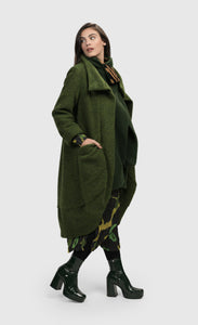 Right side full body view of a woman wearing the alembika green Gala Cocoon Jacket