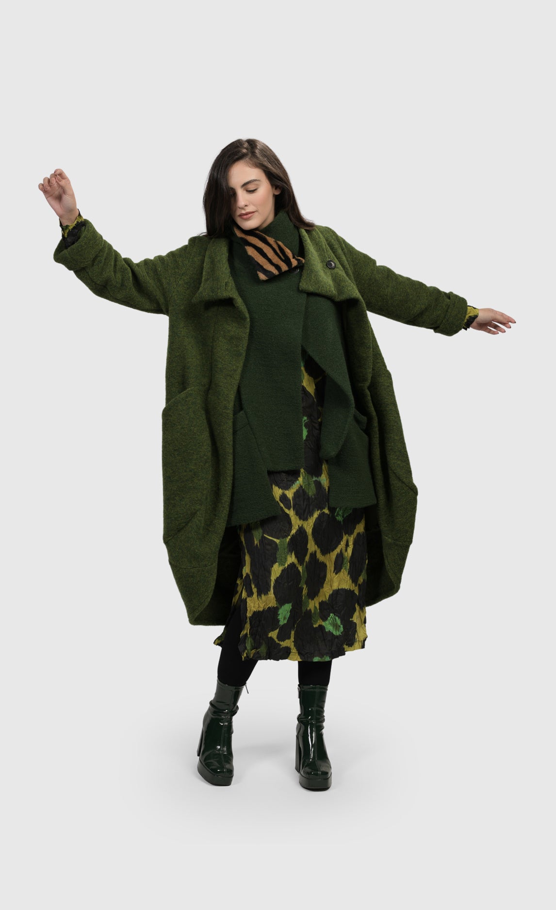 Front full body view of a woman wearing the Alembika Green Gala Cocoon Jacket