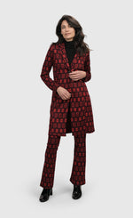 Load image into Gallery viewer, Front full body view of a woman wearing the Alembika Dynamite Days Bell Bottom Red Pants
